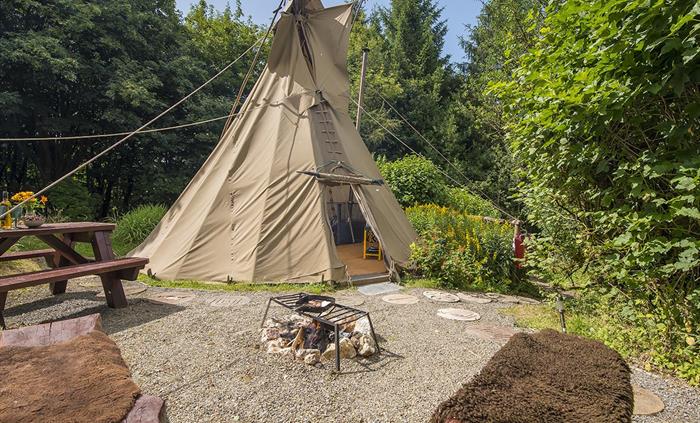 An authentically decorated Tipi - an original glamping experience. The Tipi is heated with a woodburning stove (with a fireguard). This accommodation
